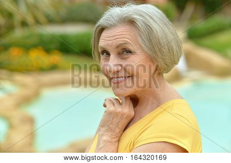 Portrait of a beautiful mature woman posing outdoors
