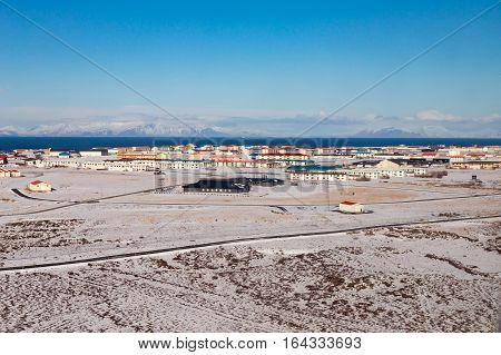 Icelandic small villaged over nautal winter landscape background