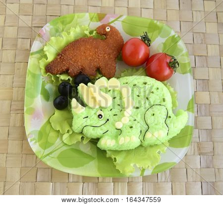 The dinosaur is made of rice. Kyaraben, bento. Creative food for children