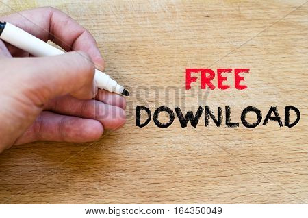 Human hand over wooden background and free download text concept