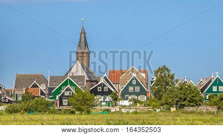 Traditional Dutch Village With With Colorful Houses And Church