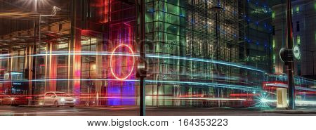 City of London streetscene with moving traffic including buses, cars and taxis
