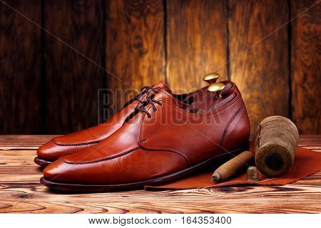 Fashion Derby Shoes Handmade And Shoemaker Tools Awl, Nails, Skien Of Thread .wooden Background.conc