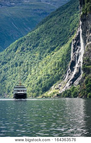 View to the Geirangerfjord in Norway with Ferry boat.