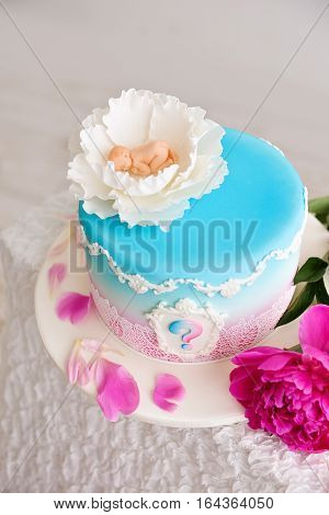 baby shower cake pink and blue flowers with a peony