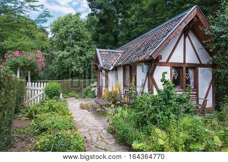 Landgraaf, Netherlands - July 12, 2016: Image of a cottage in the English garden of Park Mondo Verde.