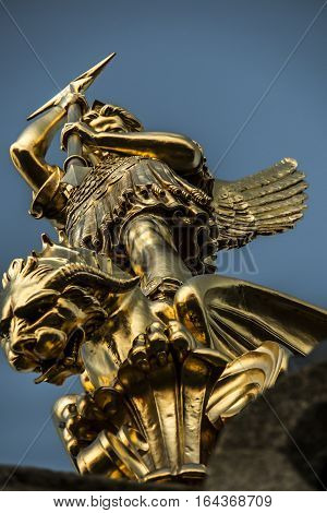 Archangel Michael fighting the dragon from the tower of the church in the town of Saint-Michel-Mont-Mercure France