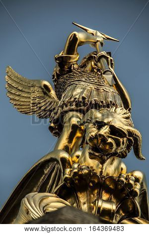 Archangel Michael fighting the dragon from the tower of the church in the town of Saint-Michel-Mont-Mercure France