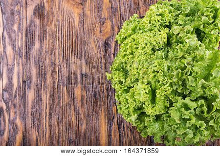 healthy eating low-calorie product. lettuce on a wooden table top view