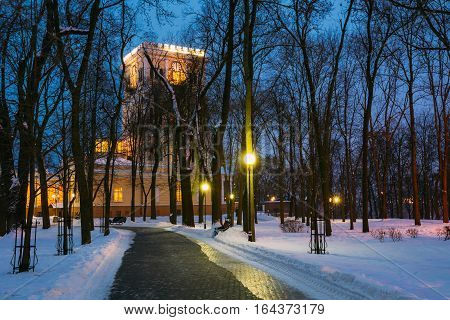 Rumyantsev-Paskevich Palace in snowy city park in Gomel, Belarus. Winter evening.