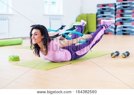 Fit woman stretching training back extension exercise