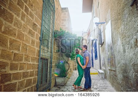 Beautiful Happy Couple Embracing And Walking On The Streets Of The Ancient City