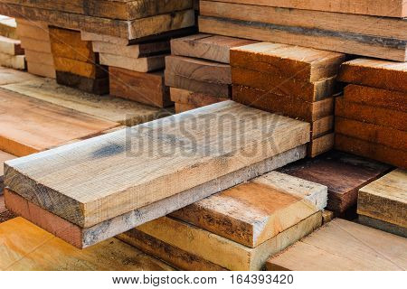 Wood panels that stand out from the pile of wood.