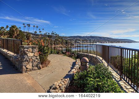 Heisler Park walkway overlooking the coastline cliffs of Laguna Beach, California in winter.