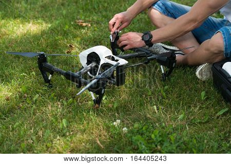 Man Tightening Drone Propeller In Nature