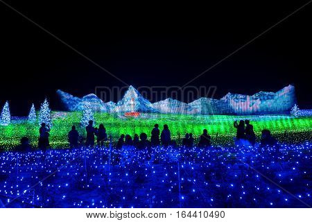 MieNagoya Japan - November 23 2015 : Unidentified tourist in blur motion visiting Nabana no sato winter illumination in Mie NagoyaJapan. It is one of Japan's largest illumination parks.