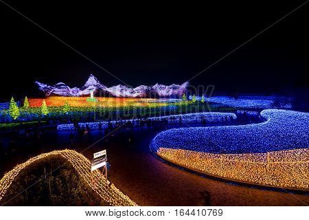 MieNagoya Japan - November 23 2015 : Unidentified tourist in blur motion visiting Nabana no sato winter illumination in Mie NagoyaJapan. It is one of Japan's largest illumination parks.