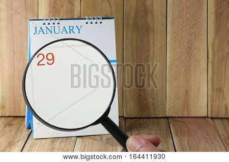 Magnifying Glass In Hand On Calendar You Can Look Twenty-nine Day Of Monthfocus Number Twenty-nine I