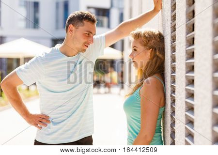 Man Flirting With Girl On City Street