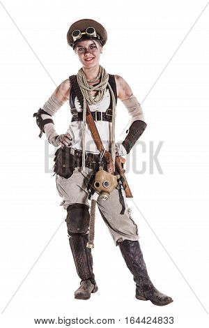 Nuclear post apocalypse life after doomsday concept. Grimy female survivor in tatters. Studio portrait on white background