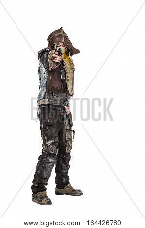 Nuclear post apocalypse life after doomsday concept. Grimy survivor with homemade weapons pointing a gun at the camera. Studio closeup portrait on white background