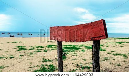 Summer design - Tropical beach with wooden sign at the sea. Ocean design  with fishing pier and beach.