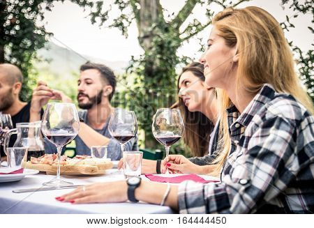 Group of friends at restaurant outdoors - People having dinner in a home garden