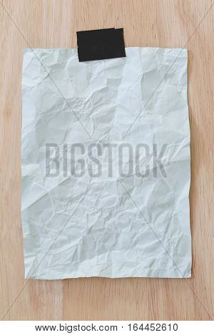 Blue notepad paper crumpled of empty and copy space on wooden backgroundYou can input the message text in picture.