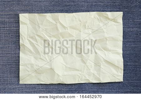 Note paper crumpled of empty and copy space on Denim backgroundYou can input the message text in picture.