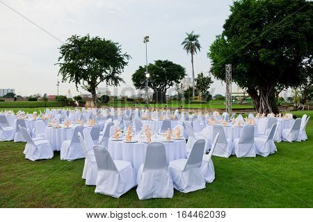 gorgeous wedding chair and table setting for fine dining at outdoors