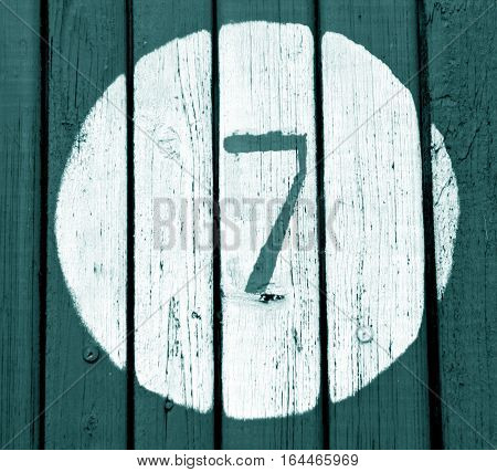 Number Seven On Cyan Toned Wooden Wall