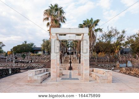 Decorative arch and bench in National Park in Capernaum (Cafarnaum).