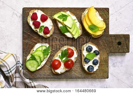 Assortment Of Fruit And Vegetable Toasts With Ricotta.top View.