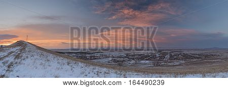 Panorama of winter sunset over the Siberian village