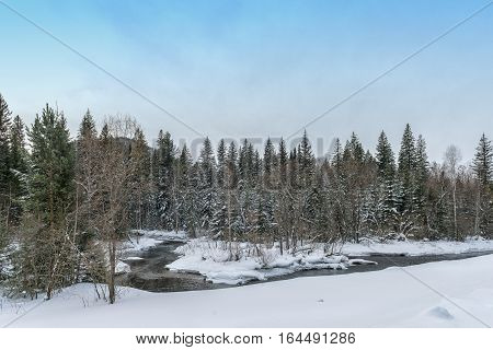 Winter landscape with river in Khakasia in Siberia