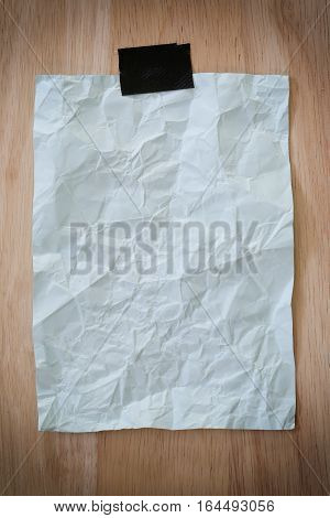 Blue notepad paper crumpled of empty and copy space on wooden backgroundYou can input the message text in picture.