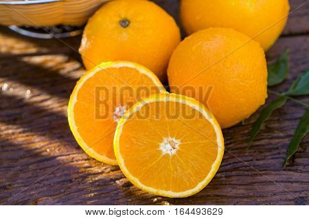 Sweet Fresh Oranges In Natural Light On Old Wood