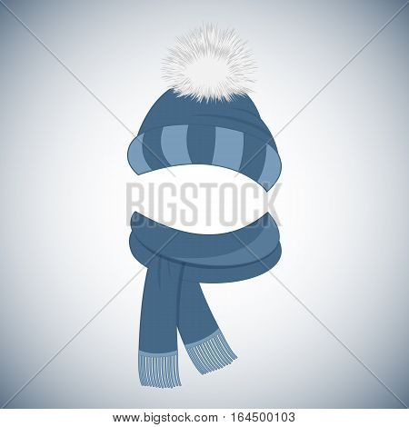 Winter blue cap with a pompom and a scarf with fringe.