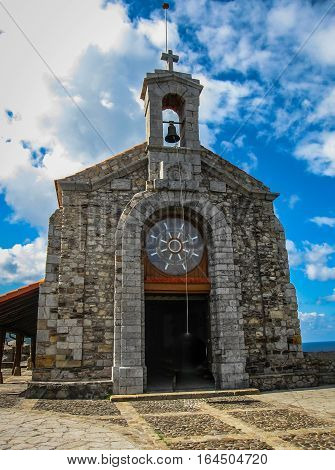 Gastelugache - island on coast of Bay of Biscay belonging to municipality of Bermeo Basque Country. Island is connected to mainland by man-made bridge that goes into winding staircase that spans 237 degrees.