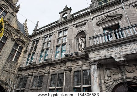 Historic town hall with flags and gold jewelry in Voerne Belgium