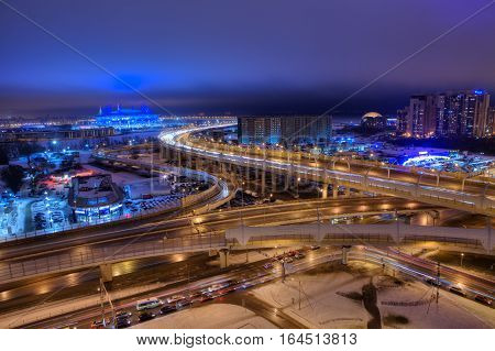 Saint-Petersburg Russia - December 29 2016: Top view of the city at night road transport interchange of the expressway and the football stadium.