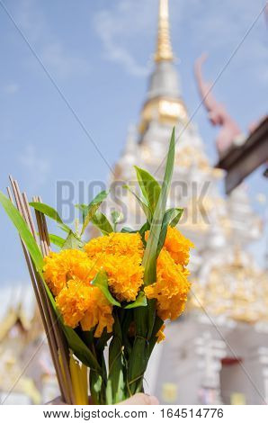 flower with incense stick and candles for worship Buddha in temple