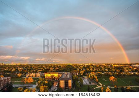 Aerial view at the Winnipeg city during rainbow after rain.