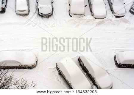 Elevated View Of Snow Covered Cars In Parking Lot
