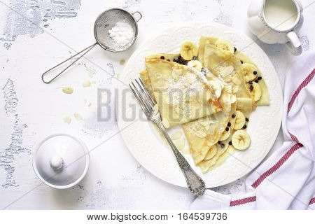 Crepes With Banana And Chocolate Chips.top View.