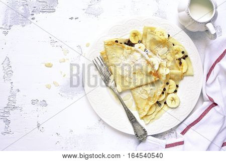 Crepes With Banana And Chocolate Chips.top View.