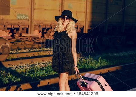 beautiful girl at raiway station. uses communication
