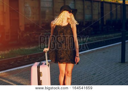 beautiful girl at raiway station. uses communication