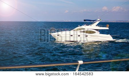 A luxury private yacht under way in the sea.