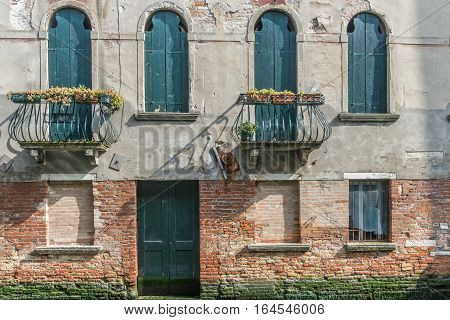 An old Venician house with five window and a door